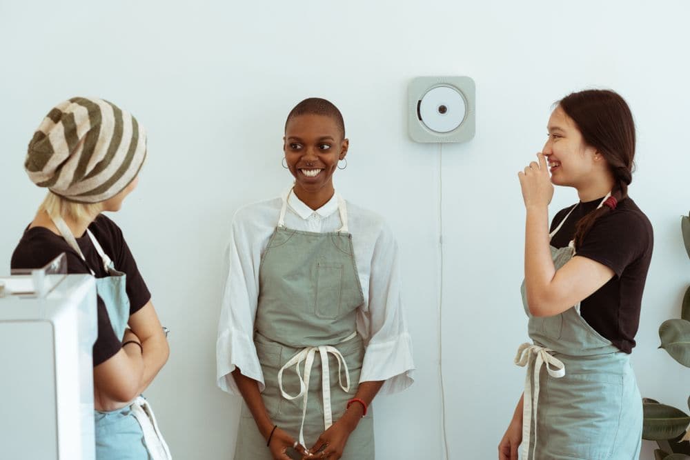 Baristas welcoming a new colleague