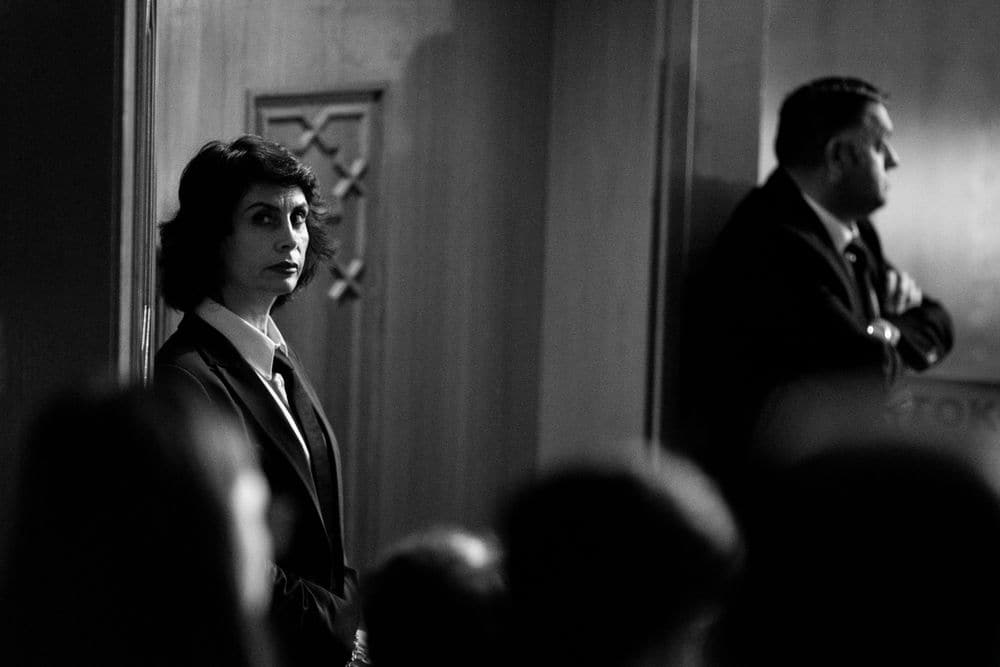 Security staff watching over a formal event